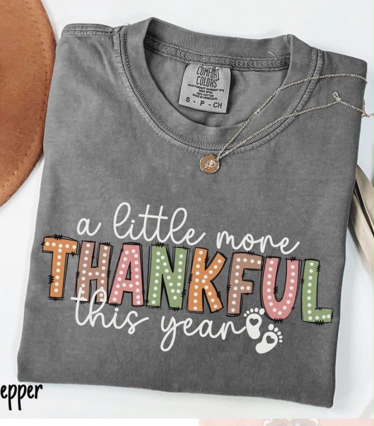 A Little More Thankful This Year tee in Pepper with colorful lettering and baby footprints