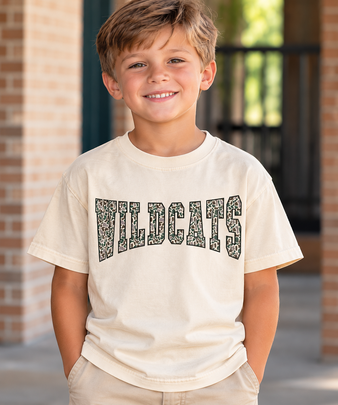 Boy wearing ivory youth Wildcats camouflage graphic t-shirt